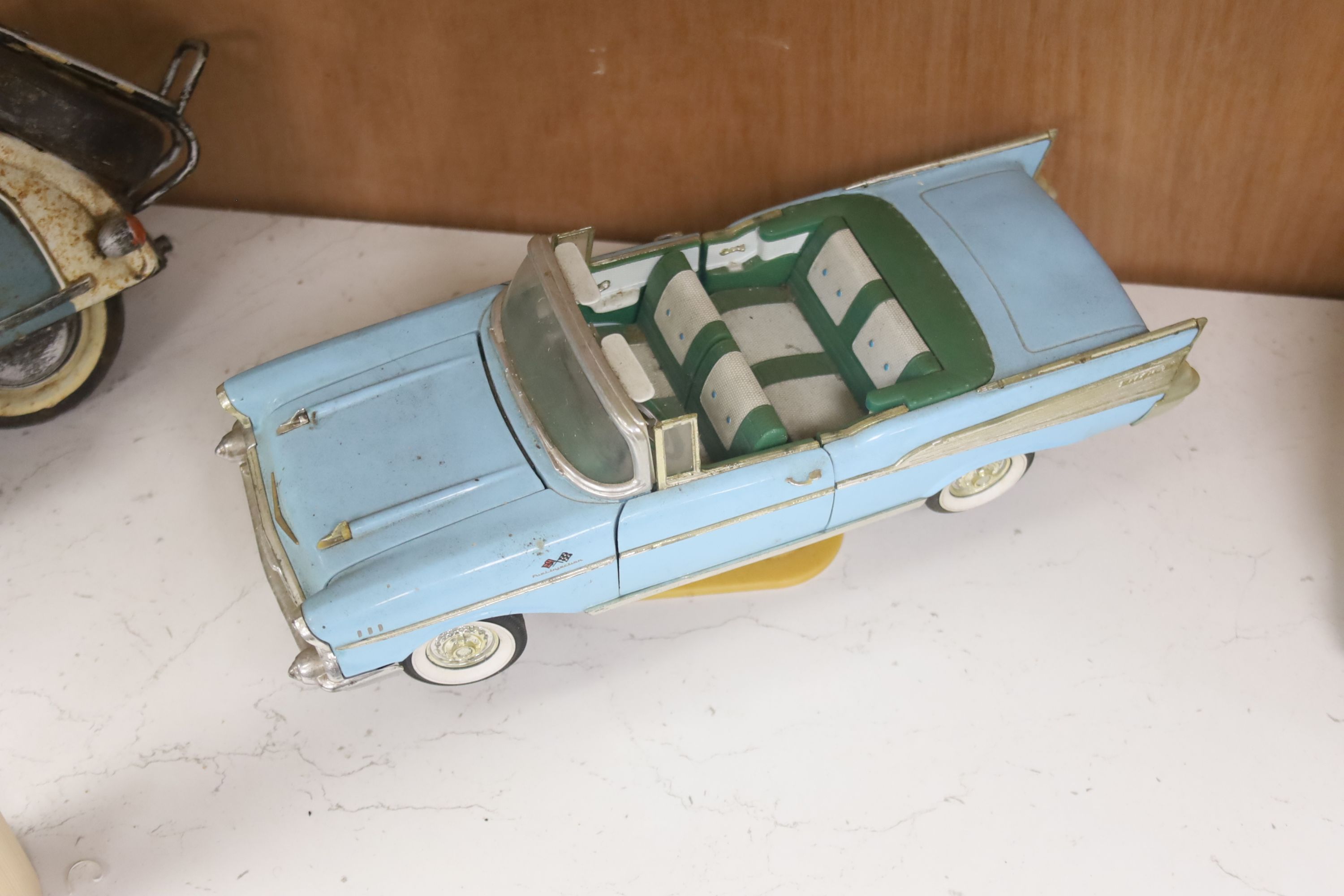 A model of a VW Camper van, a Lambretta and a 1950s Cadalac